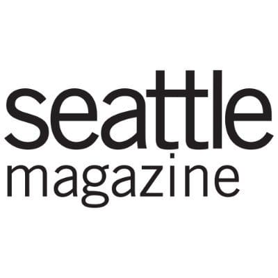 The image shows the "seattle magazine" logo in bold, black lowercase letters on a white background, reflecting strong creative direction often seen in professional photoshoot branding.